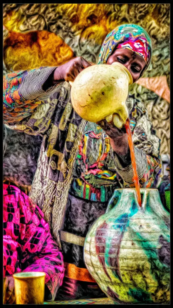 Jus de Bissap : Recette, Bienfaits et Secrets de cette Boisson Miracle 1 femme versant une infusion de bissap dans