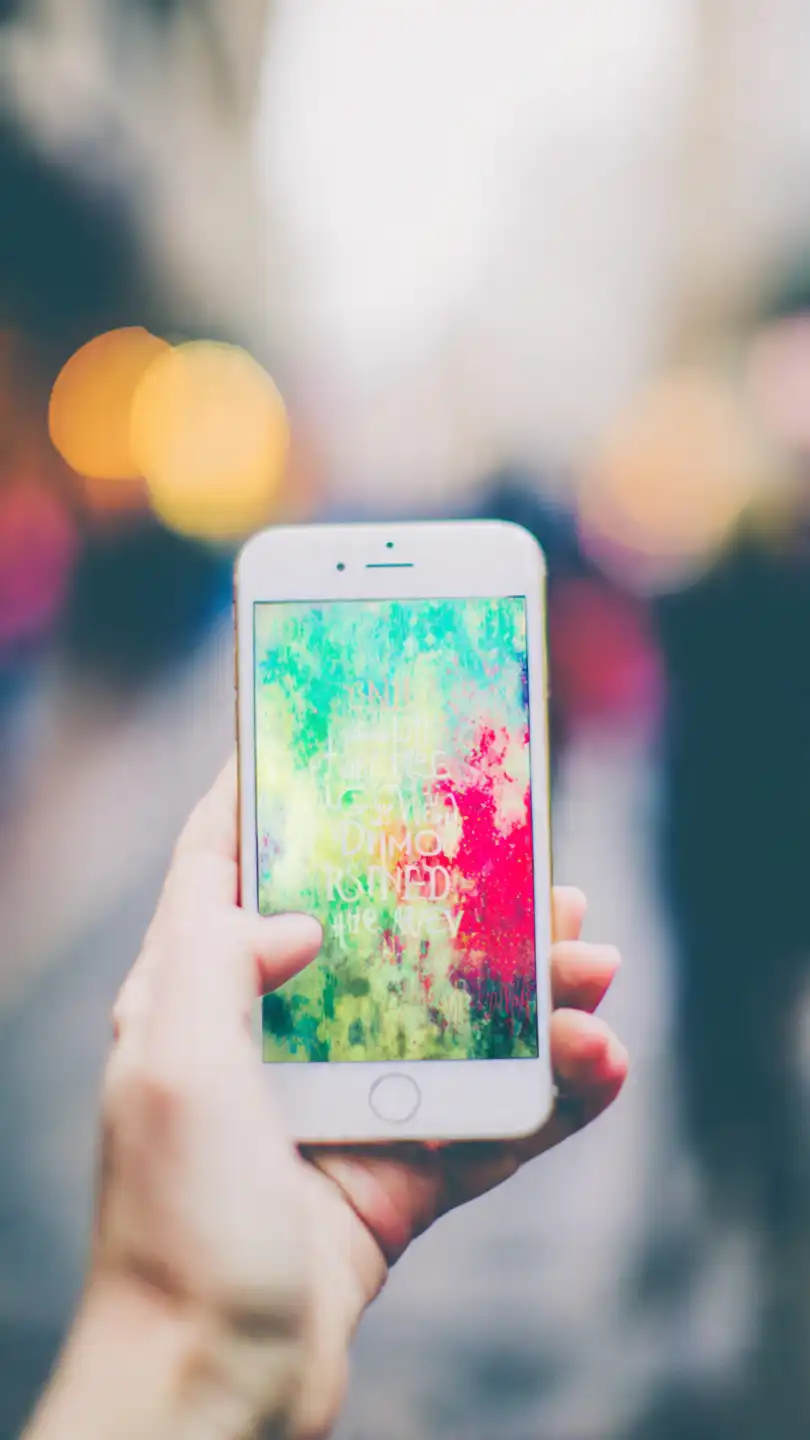 hand holding a modern smartphone showing a